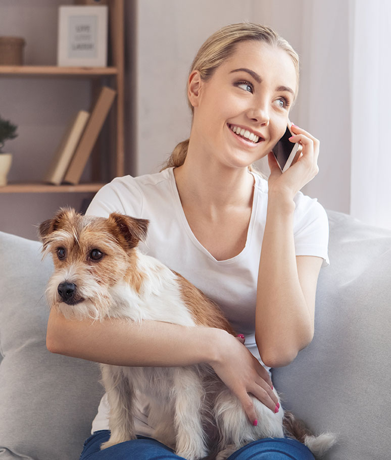 woman with terrier on phone